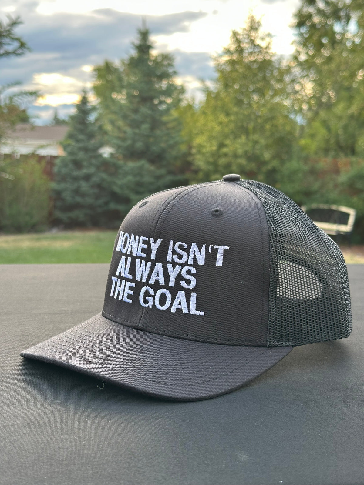MONEY ISN’T ALWAYS THE GOAL - Black Trucker Hat