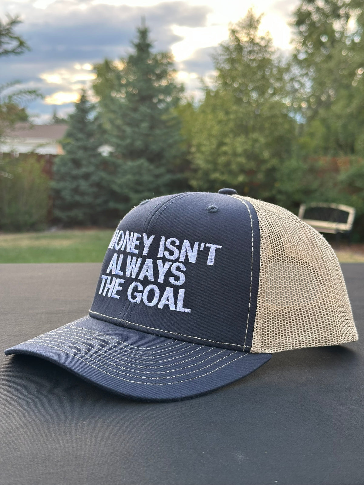 MONEY ISN’T ALWAYS THE GOAL - Black Trucker Hat