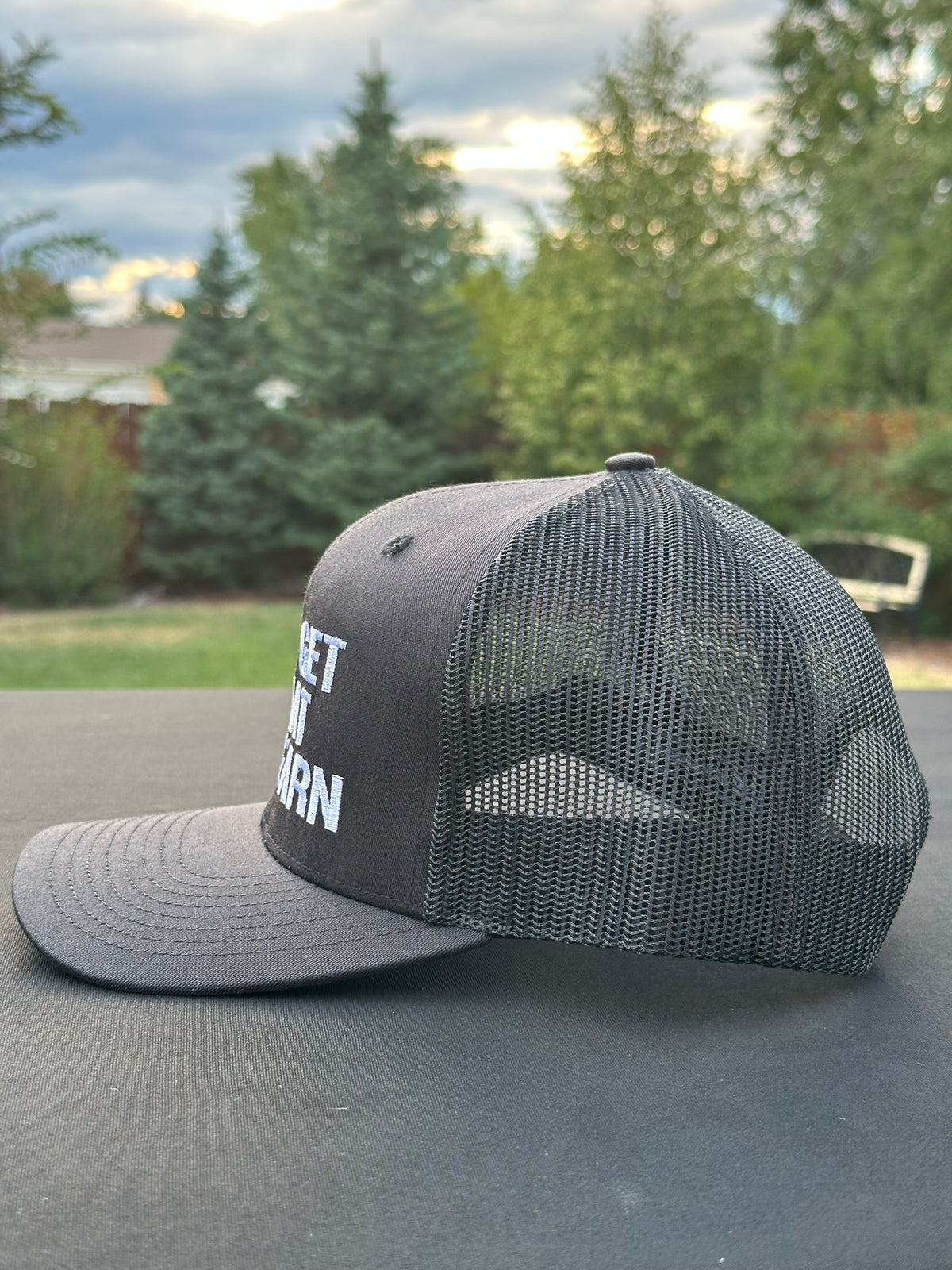 YOU GET WHAT YOU EARN - Black trucker Hat